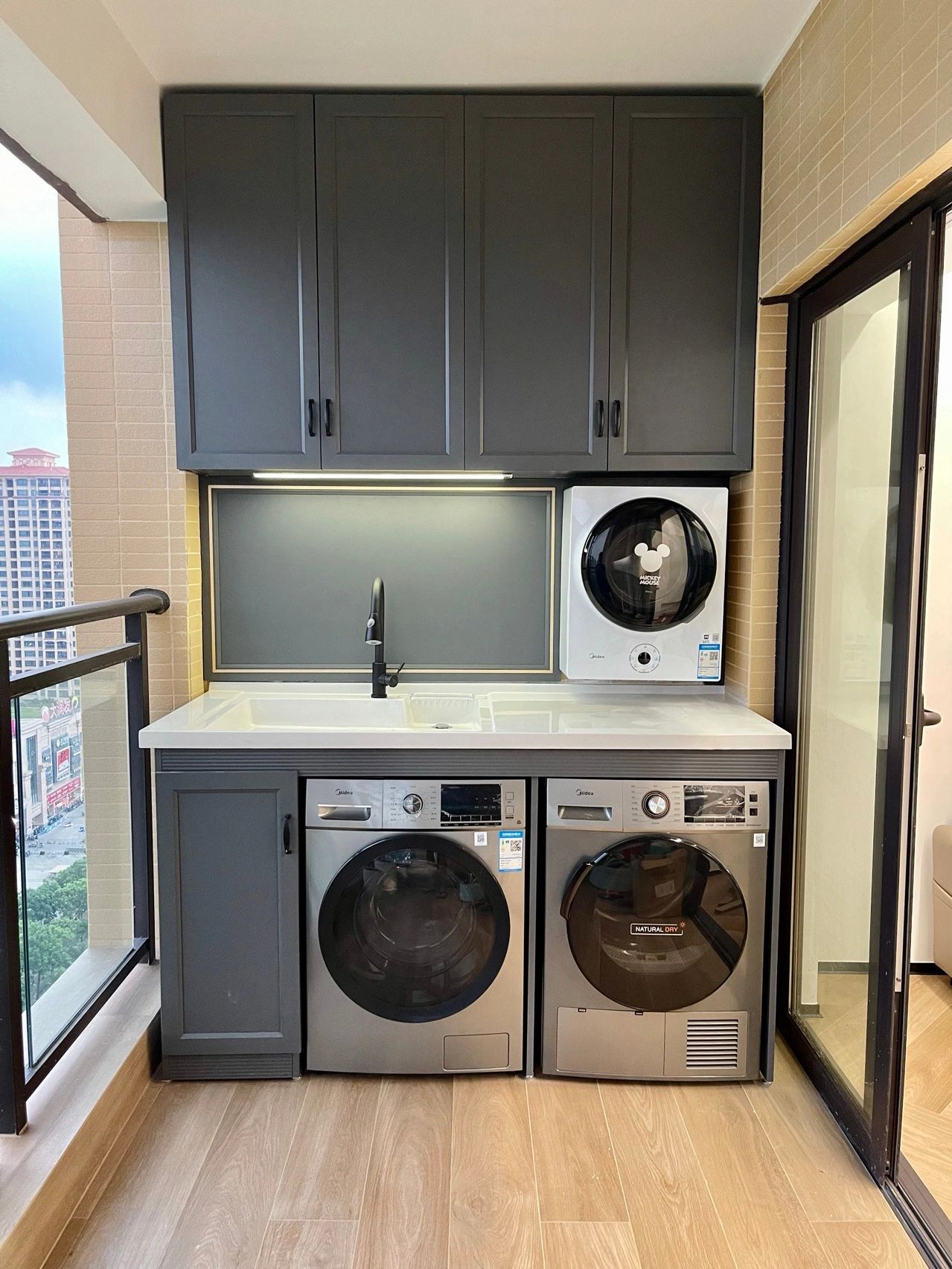 Gray side-by-side washer and dryer laundry cabinet Gray side-by-side washer and dryer laundry cabinet