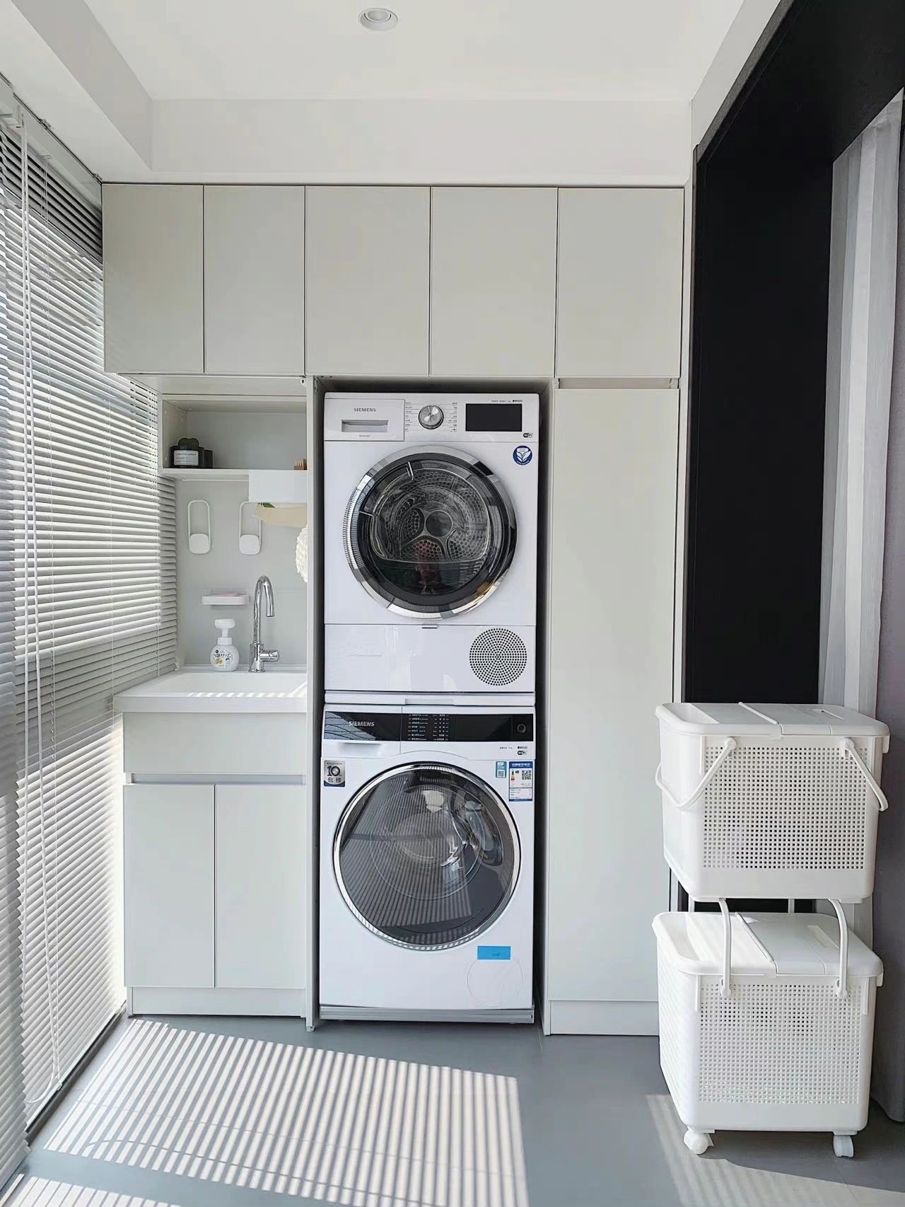 Minimalist matte white laundry cabinet Minimalist matte white laundry cabinet